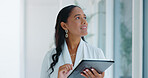 Business woman, tablet and reading in hallway at modern office with communication, vision and networking. Person, touchscreen and typing with thinking, application and problem solving in workplace