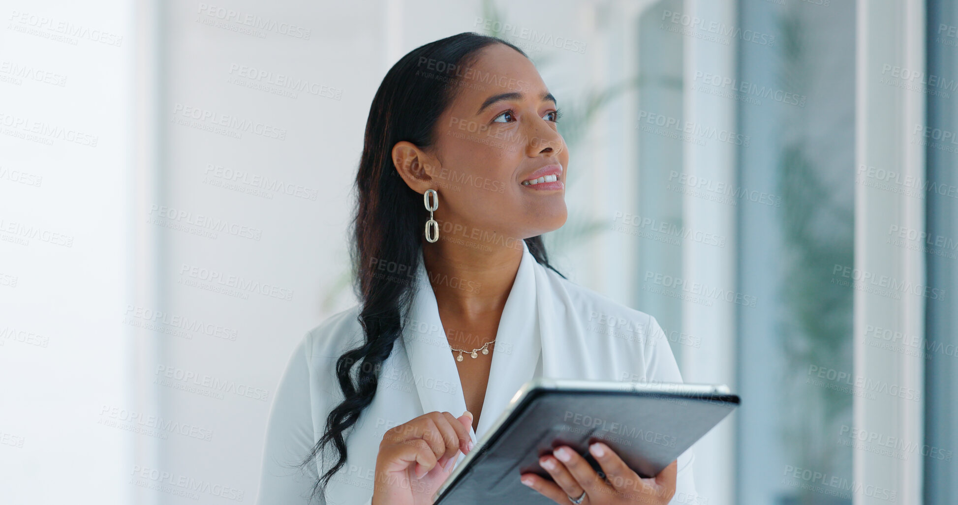 Buy stock photo Business woman, tablet and reading in hallway at modern office with communication, vision and networking. Person, touchscreen and typing with thinking, application and problem solving in workplace