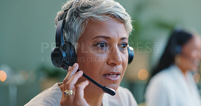 Mature woman, headset and customer service in call centre, and telemarketing for sales to leads. Advisor, talking or consultant in office at desk, negotiation or productivity client support by desk
