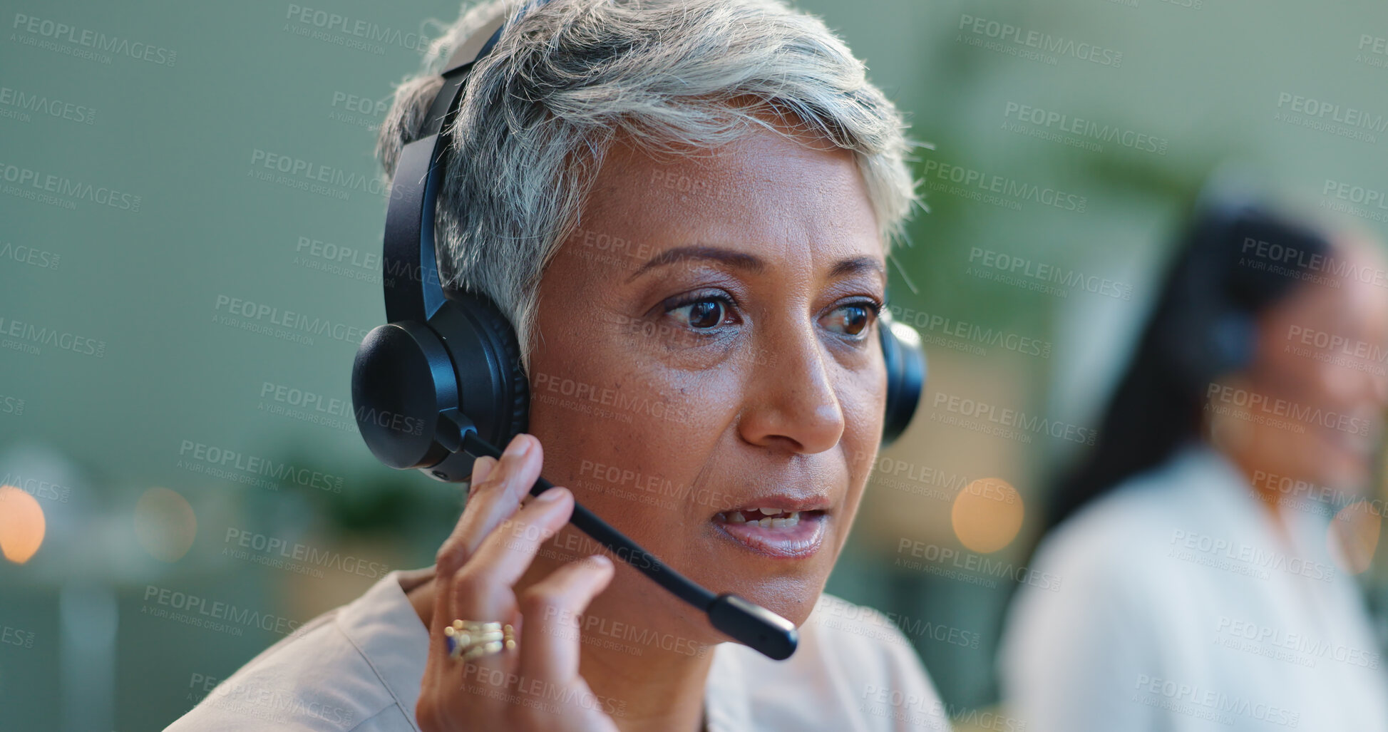 Buy stock photo Mature woman, headset and customer service in call centre, and telemarketing for sales to leads. Advisor, talking or consultant in office at desk, negotiation or productivity client support by desk