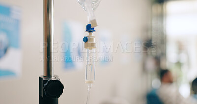 Hospital, health and closeup of IV drip for medicine, infusion and medication dose for patient. Wellness, clinic and blur of patient with liquid antibiotics for treatment, sickness and medical care