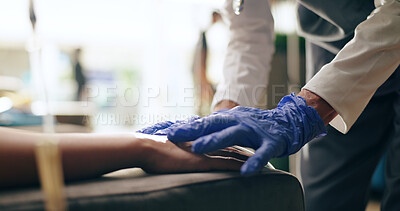 Nurse, needle and hands with medical gloves at a hospital with vaccine and healthcare IV infusion. Medicine, clinic and support with patient and doctor helping with blood sample for treatment