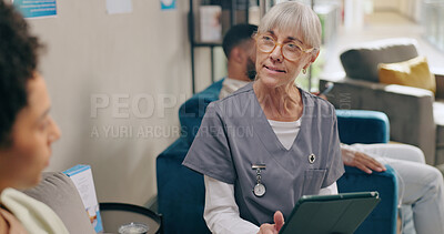 Senior woman, nurse and consulting patient with tablet for prescription, diagnosis or results at hospital. Female person and scrub talking to client on technology for appointment or checkup at clinic