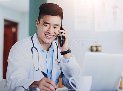 Buy stock photo Healthcare, laptop and phone call with doctor writing in office of hospital for appointment or schedule. Computer, notepad and smile with asian medicine professional in clinic for consultation