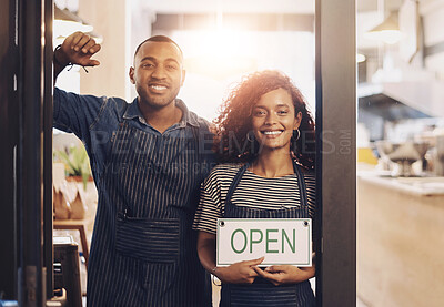 Buy stock photo Coffee shop, open sign and portrait of people in cafe for small business, teamwork and collaboration. Restaurant, hospitality and happy man and woman by cafeteria door for service, help and welcome