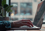 Laptop, hands and person typing in home with creative research for online copywriting. Technology, keyboard and freelance writer work on project with information for deadline on computer in apartment