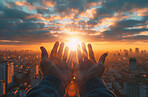 Sunset, outdoor and palms of hands for hope with future, spiritual and freedom for wellbeing. Silhouette, city and night for prayer, worship and peace with thanks, light and energy for zen in summer