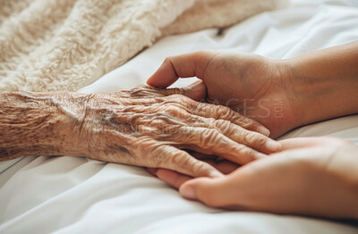 Hands, elderly and person in bed, nurse and rehabilitation in hospital, support and compassion for patient. Retirement, senior and caregiver with empathy, healthcare and bedroom of nursing home
