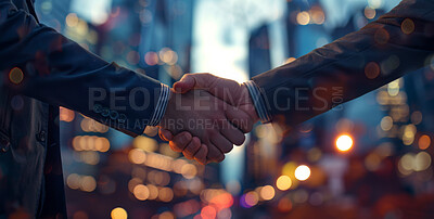 Business people, handshake and meeting in city for deal, partnership or introduction in New York. Corporate clients or worker shaking hands for travel opportunity, agreement or success in night bokeh