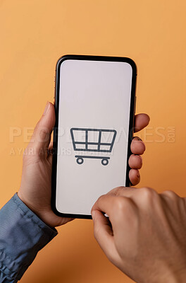 Hands, person and smartphone screen with cart, ecommerce and payment on yellow studio background. Online shopping, model and customer with cellphone and client with purchase and symbol for buying
