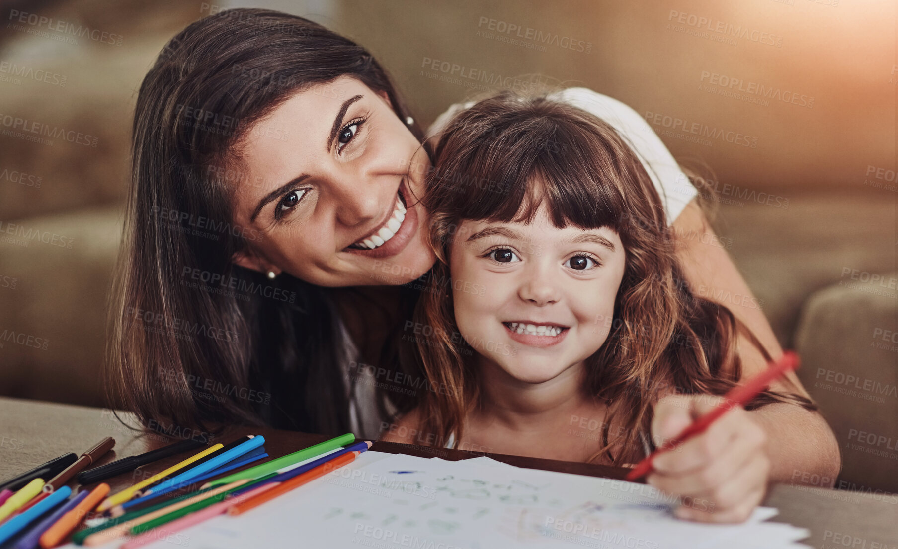 Buy stock photo Portrait of a young woman drawing together with her young daughter at home