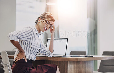 Buy stock photo Woman, back pain and laptop in office with stress, discomfort and muscle tension with mockup. Female lawyer, tired and fatigue in workplace with bad posture, overworked and burnout in law firm