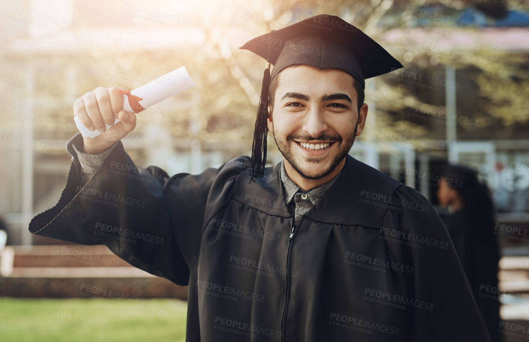 Buy stock photo Graduation, portrait and happy man with degree at university, success and achievement in Brazil. Male student, smile and proud with certificate for goal, celebration and award on campus for ceremony