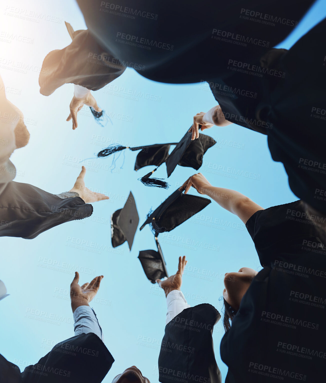 Buy stock photo Students, happy and graduation cap in sky on campus with celebration and success. People, college and university classmate or friends with pride or excited for qualification competition in low angle