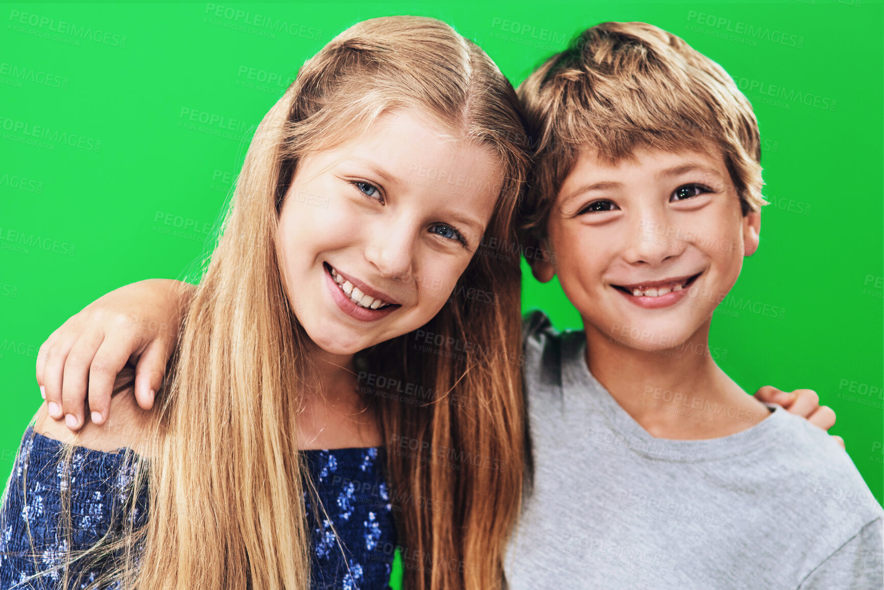 Buy stock photo Siblings, smile and portrait in studio, embrace and together with love, family or cheerful for school. Hug, girl and boy in green background, happy or kids with confidence for first day in elementary