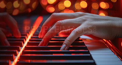Hands, piano keys and playing in closeup with light for jazz music with person, skill or talent with glow. Night, art and entertainment with creative for in recording studio with performance for song