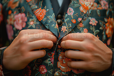 Closeup, man and fashion with hands on suit for classy gala, event or evening party with elegance. Male person, fingers and luxury clothes with floral pattern for rich style, tailor and material