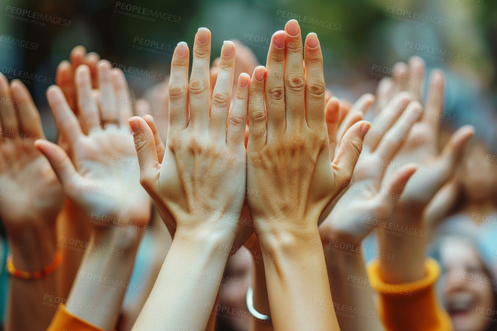 Buy stock photo Hands up, group and crowd in celebration at party of community at outdoor event for success, winning or goal. Audience fingers, palm raised and people with support, achievement and teamwork together