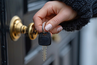 Key, lock and hand of woman at door by home for security, safety or protection to townhouse. Landlord, mortgage and person opening entrance at new residential apartment for access or entry at estate.