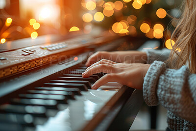 Hands, piano key and playing in closeup with bokeh in studio with child development for learning. Recital, musical and sound with talent in creative with musician for audio with recording for song