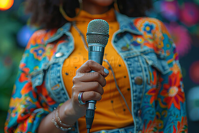 Hand, singer and woman with mic at event for singing, talking or announcement with colorful fashion. Musician, performance and female person with microphone for musical talent on stage at concert.