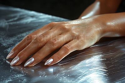Woman, hand and nails in closeup for art or beauty, treatment or care at spa. Female person and manicure with fingers and zoom at salon, cosmetic on metal or texture for self care or wellness