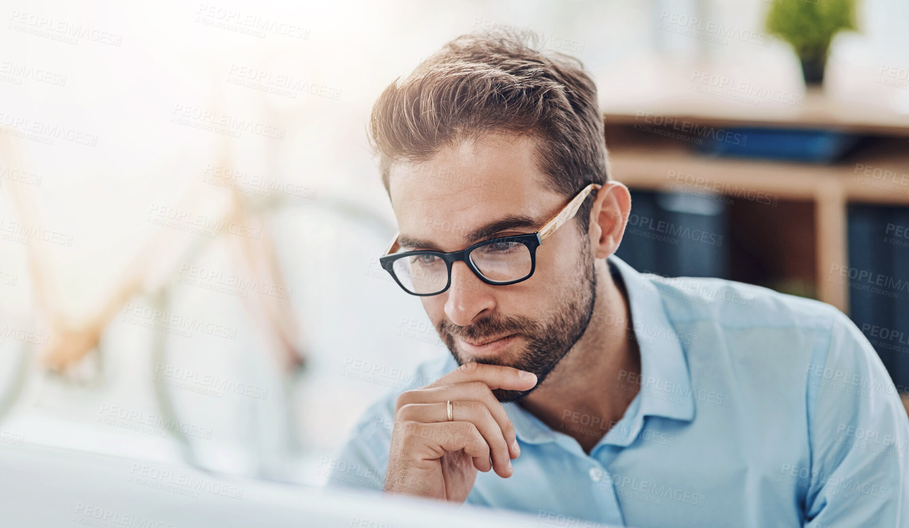 Buy stock photo Glasses, smile and man in office, computer and market research for social media manager, online and reading. Thinking, digital and working for agency, ideas and goal of project in morning and desk