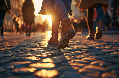 People, feet and city ground with walking with population commute as workforce, downtown or explore. Person, shoes and urban with sunset light in France as pedestrian on street, crowd or footwear