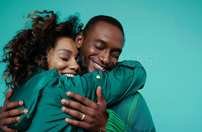 Studio, happy couple and hug in blue background for love, affection and romance with backdrop. African people, man and woman for bonding, relationship and married with commitment in mockup space