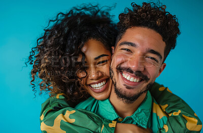 Love, portrait and smile with interracial couple hugging in studio isolated on blue background. Emotion, face or romance with happy young man and woman embracing for bonding or relationship together