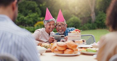 Elderly, couple and happy with video call at birthday party for celebration, laughing and memories in garden. Senior, man and woman with smartphone for photography, gathering and event in backyard