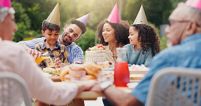 Children, parents and happy with hat at birthday party for celebration, laughing or memories in garden of home. Family, couple and kids with happiness for funny joke, gathering and event in backyard