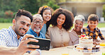 Selfie, family and birthday in backyard with happy, social media and grandparents outdoor. Home, smile and table with celebration and party cake in garden with parents and kids with love and food