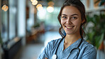 Portrait, woman and doctor with smile, healthcare or confidence with career ambition or hospital. Face, person or medical with professional, surgeon or physician with stethoscope or uniform in clinic