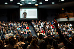 Hand, question or screen in hall for seminar, conference or presentation with digital information. Audience, corporate workshop or training for startup knowledge, project skill or professional growth