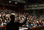 Politician, man and back for speech at conference in election campaign, public discussion or debate. Political party leader, speaker and presenter with rally, information or call to action for voting