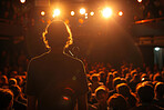 Man, back and stand up comedy by crowd for funny story, joke or show at international festival. Person, artist or comic on stage, speech and performance at benefit concert for human rights in Canada