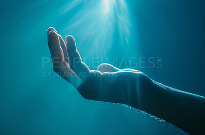 Hand, light and faith with prayer or worship for belief, trust in god or Jesus. Fingers, palm and sunshine for spiritual or religion with christ, reaching for heaven or help on blue background