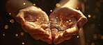 Offer, prayer and glitter in hands of person closeup for belief or faith in God with miracle stars. Galaxy, magic and universe in palm of adult praying for praise or worship as tradition of religion