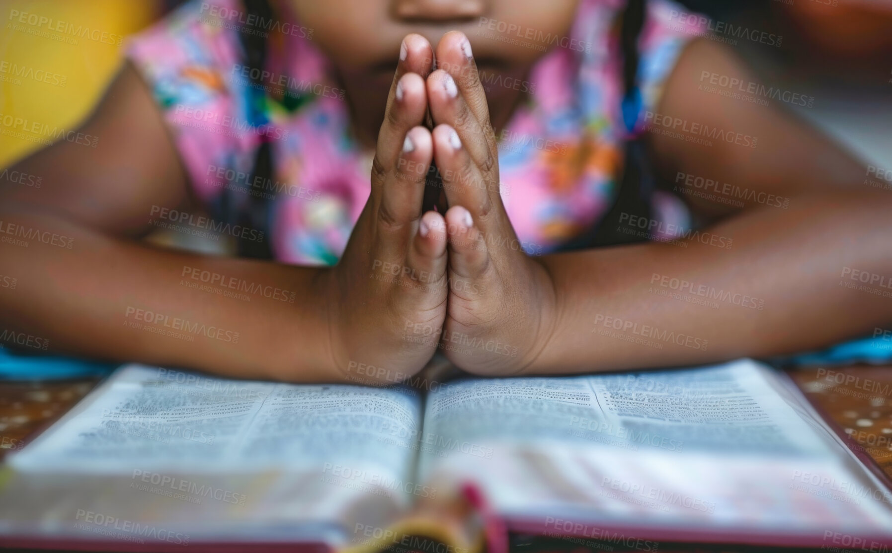 Buy stock photo Prayer, faith and kid with hands on bible in home for hope, thanks and gratitude to God in gospel. Praise, worship and child with holy book, spiritual respect and children with Christian religion 