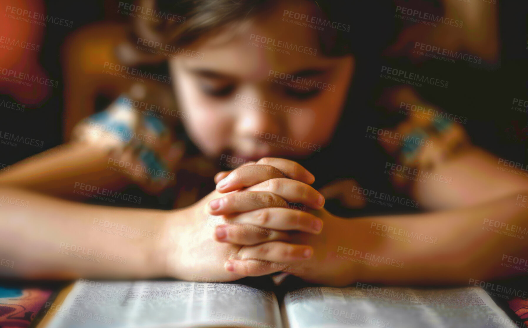 Buy stock photo Prayer, faith and child with hands on bible in home for hope, thanks and gratitude to God in gospel. Praise, worship and kid with holy book, spiritual respect and children with Christian religion 