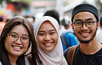 Portrait, friends and Muslim with smile on vacation, holiday and journey in winter by blurred background. Happiness, group and face of young people outdoor in city, street and students in Malaysia