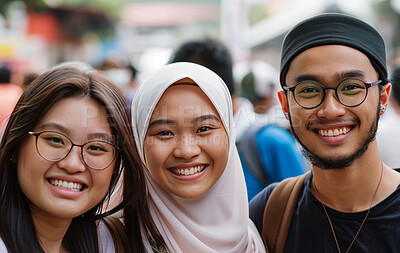 Portrait, friends and Muslim with smile on vacation, holiday and journey in winter by blurred background. Happiness, group and face of young people outdoor in city, street and students in Malaysia