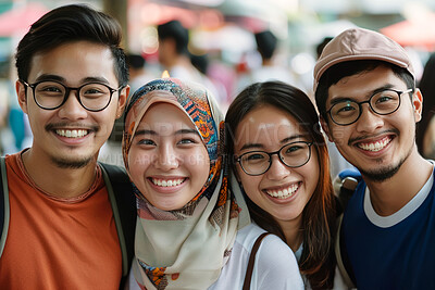 Portrait, friends and Muslim students on vacation, holiday and journey in winter by blurred background. Happiness, group and face of young people outdoor in city, street and youth in Malaysia