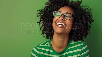 Girl, happy and smile with glasses by green background for good news, funny memory and pride in studio. Female person, face and cheerful with comic, remember or information with laugh by backdrop