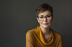 Confident, portrait and mature executive assistant in studio on gray background for administration. Corporate, face and glasses with professional business woman at work for company mission or vision