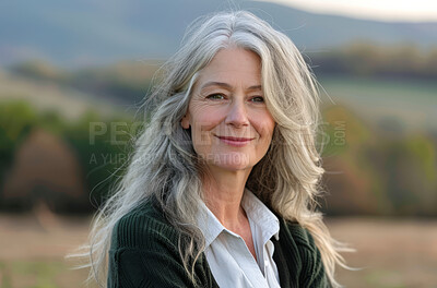 Mature woman, portrait and outdoor nature for peace, vacation and relax on hill or forest field. Female person, calm and holiday in retirement for wellness, trees and smile for health in environment