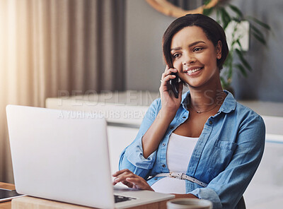Buy stock photo Shot of a pregnant young woman using a laptop and mobile phone while working from home