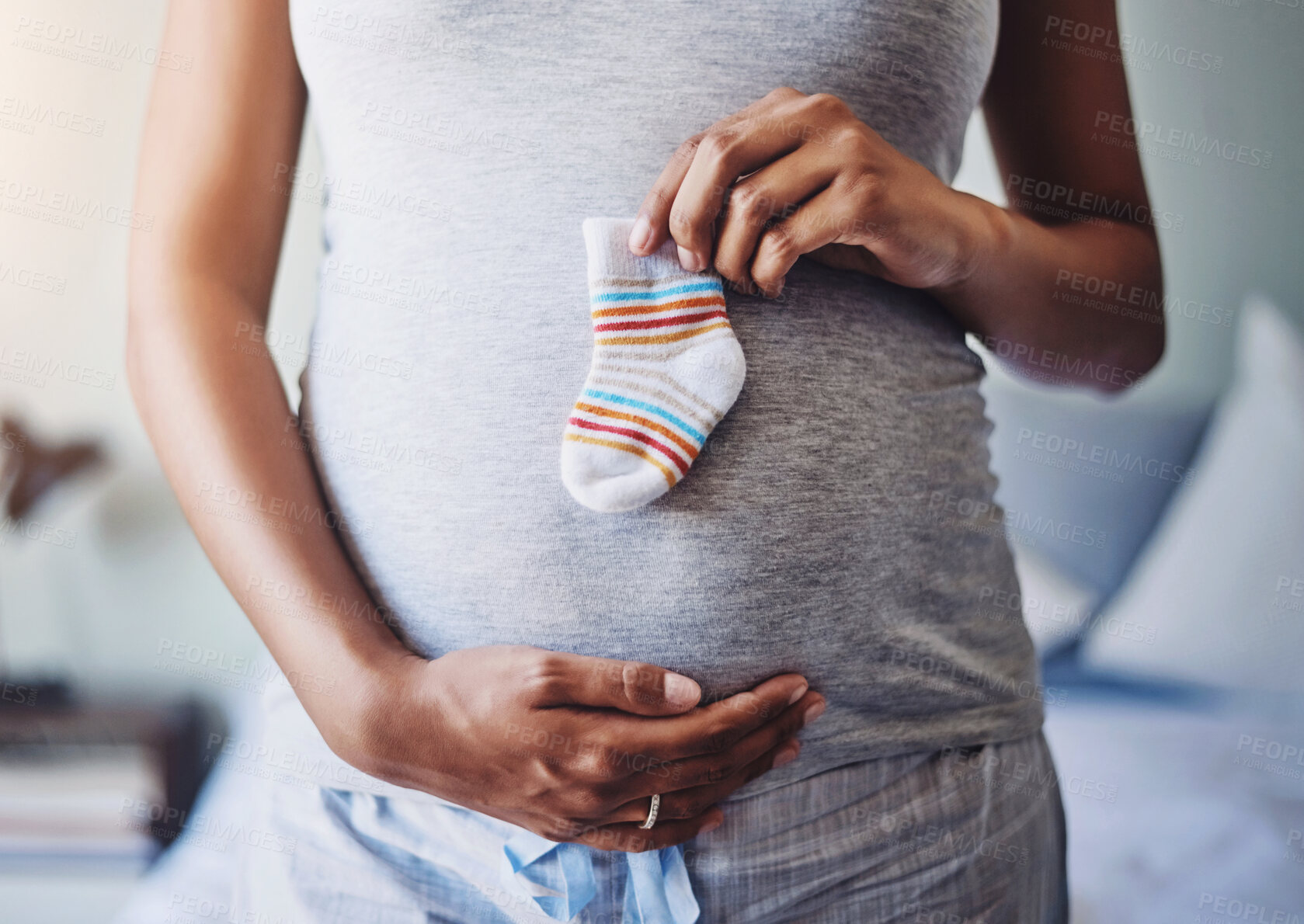 Buy stock photo Woman, holding sock and pregnancy in home for future child, motherhood and gratitude for new mama. Pregnant girl, belly and infant clothes for baby with preparation, wellness and ready for kids 