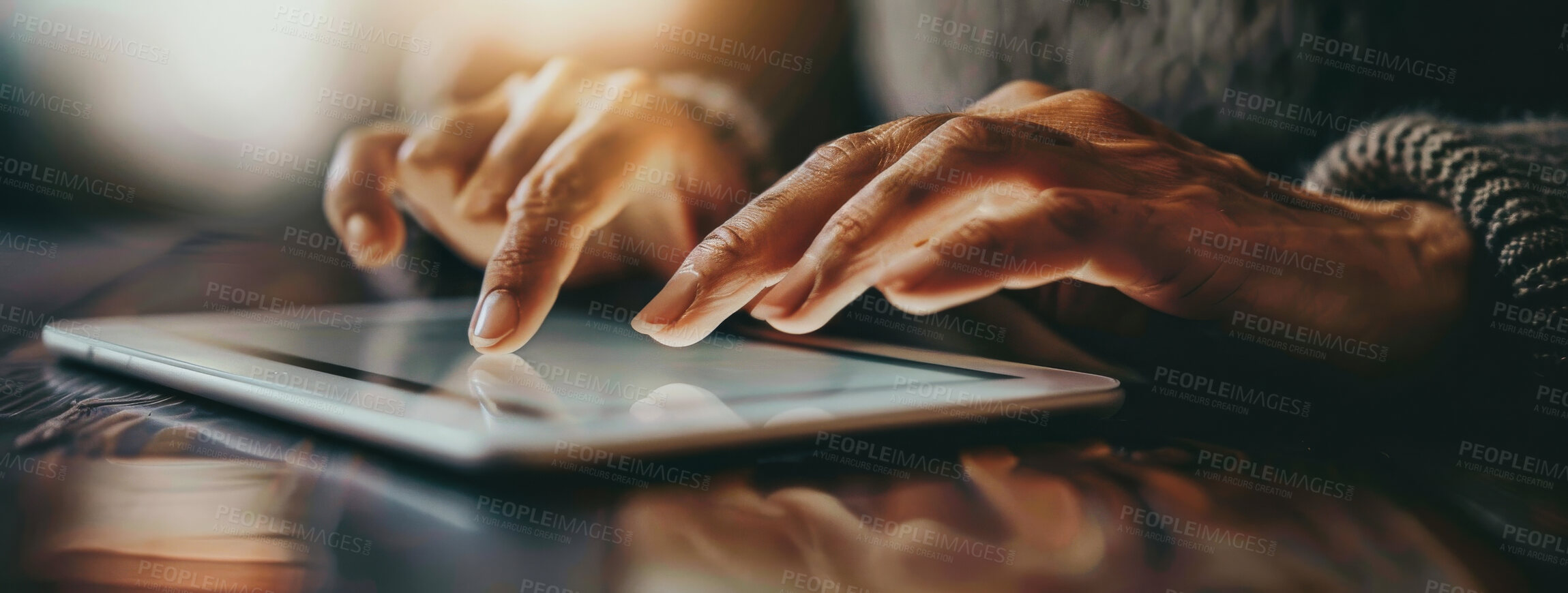 Buy stock photo Closeup, hands and typing on tablet for email, communication or searching web in home. Lens flare, connect and senior person with technology for social media, information or browsing internet